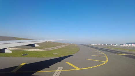 view from an airplane window on the runway at an airport