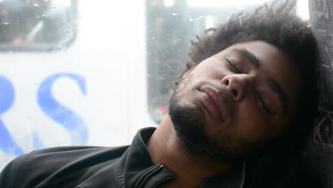 Young-African-American-Black-Man-Sleeps-on-Bus-Chair-Sitting-Down-Close-Up