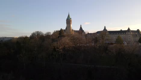 drone flying towards watch tower in luxembourg city center