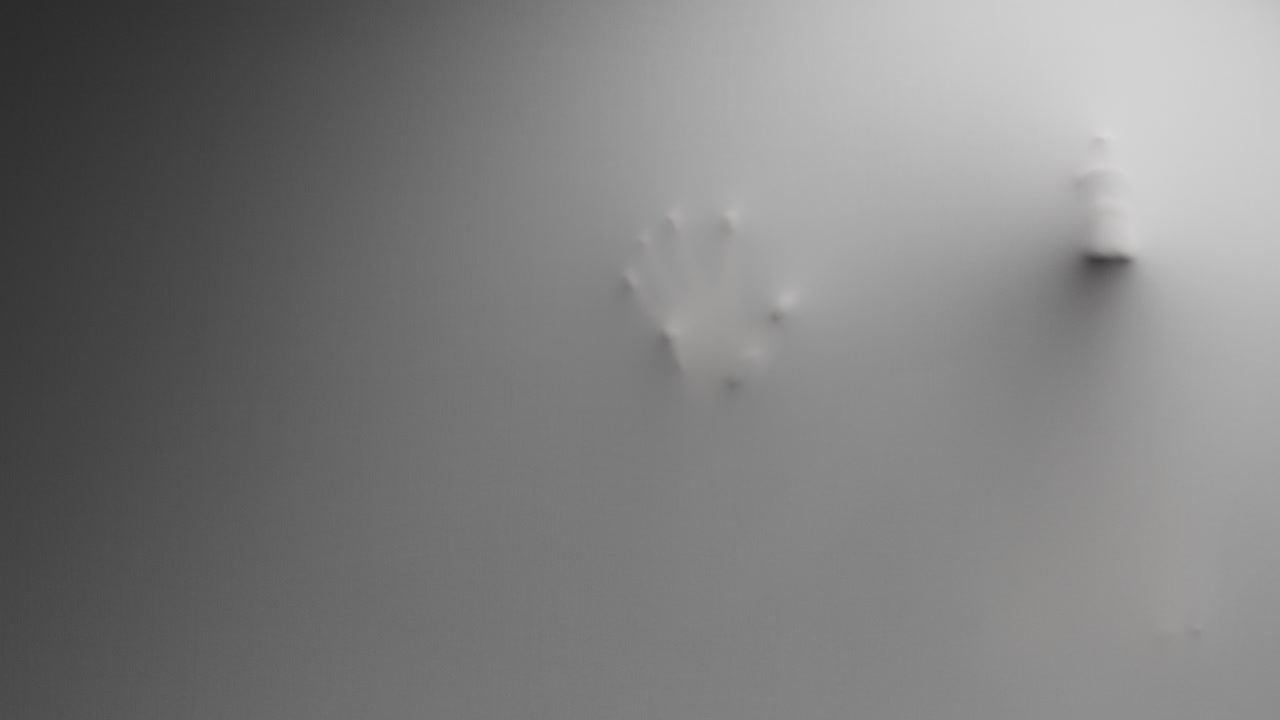 A creepy silhouette of a woman appears from the white surface