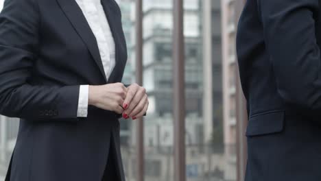 cropped shot of coworkers shaking hands