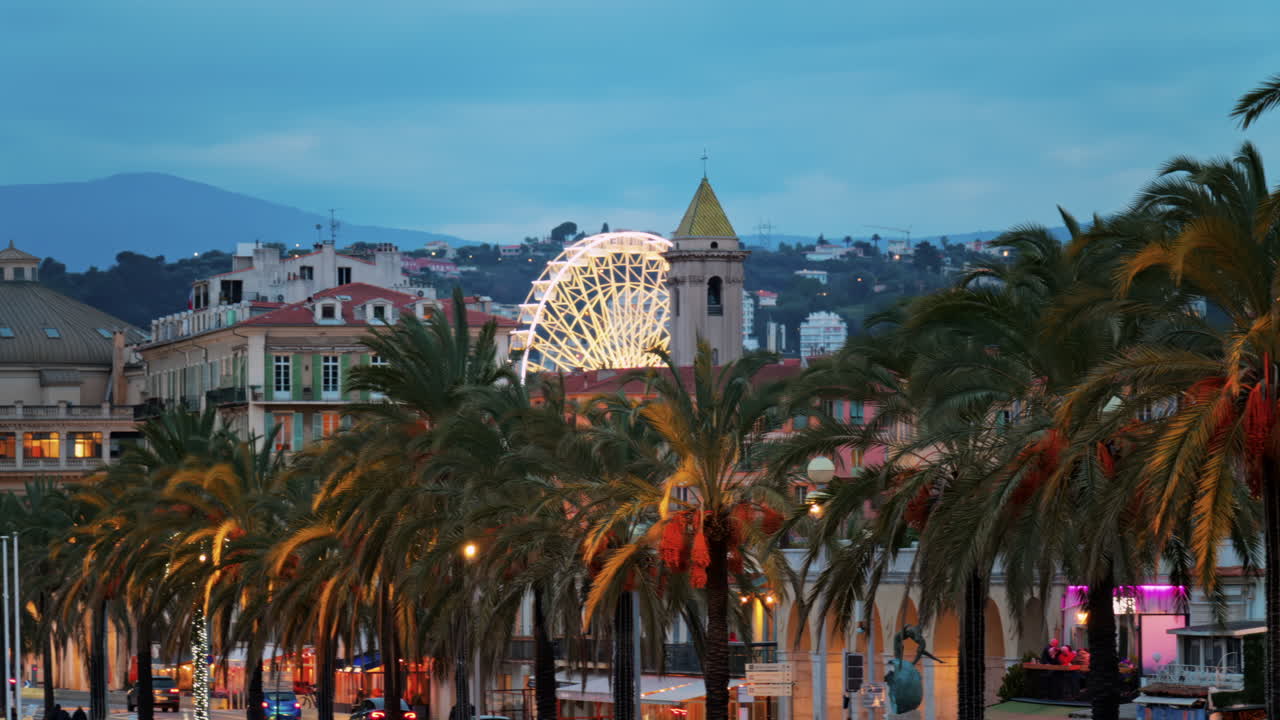 Nice, France - February 4, 2025: Distant view of the Promenade des Anglais along the Mediterranean coast of the city in the evening