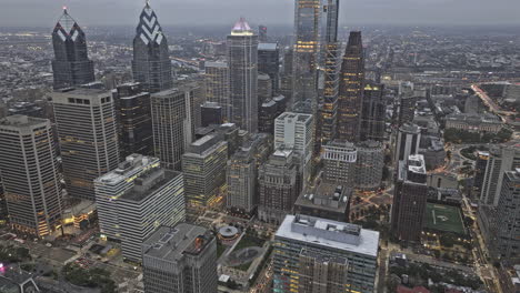 philadelphia pennsylvania aerial v180 flyover center city capturing downtown cityscape under gloomy overcast sky at dusk, birds eye view of city hall - shot with mavic 3 pro cine - sept 28th 2023