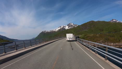 Vehicle-point-of-view-Driving-a-Car-VR-Caravan-travels-on-the-highway.-Tourism-vacation-and-traveling.-Beautiful-Nature-Norway-natural-landscape.