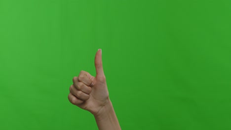 two hands giving a thumbs up on a green screen