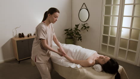 woman receiving an arm massage at a spa