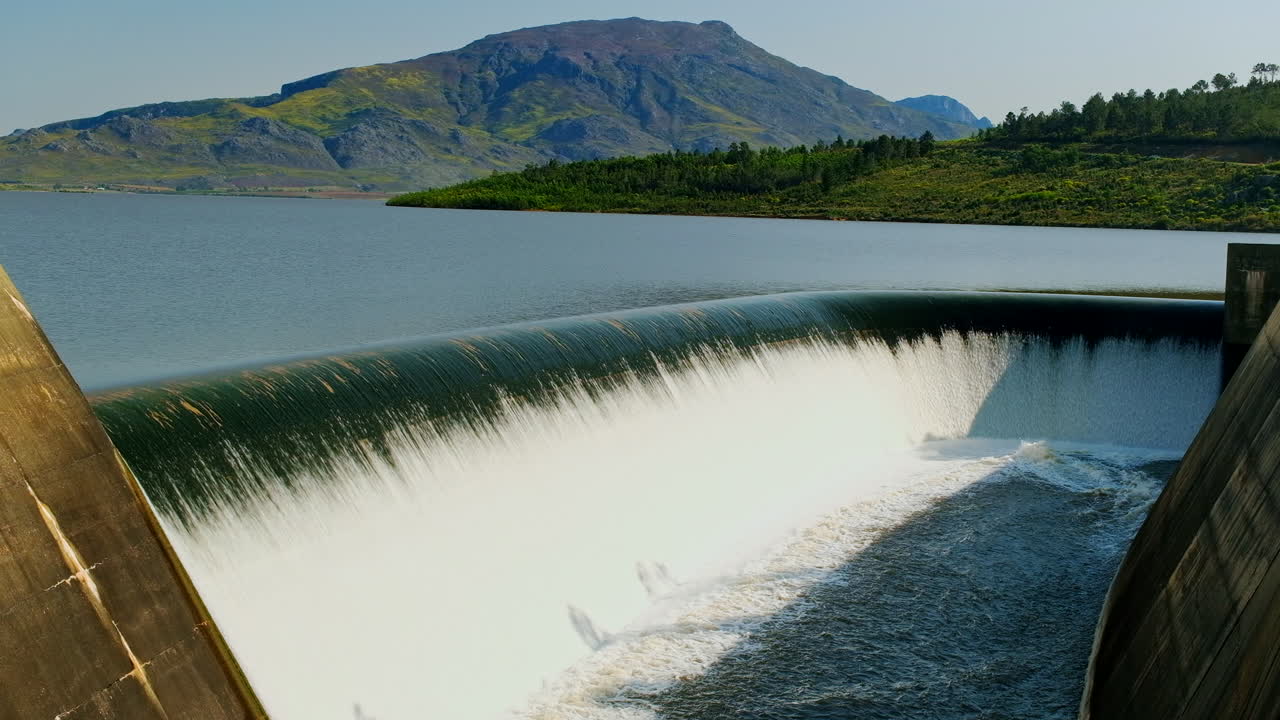 Theewaterskloof dam spillway with water cascading over, flooding control