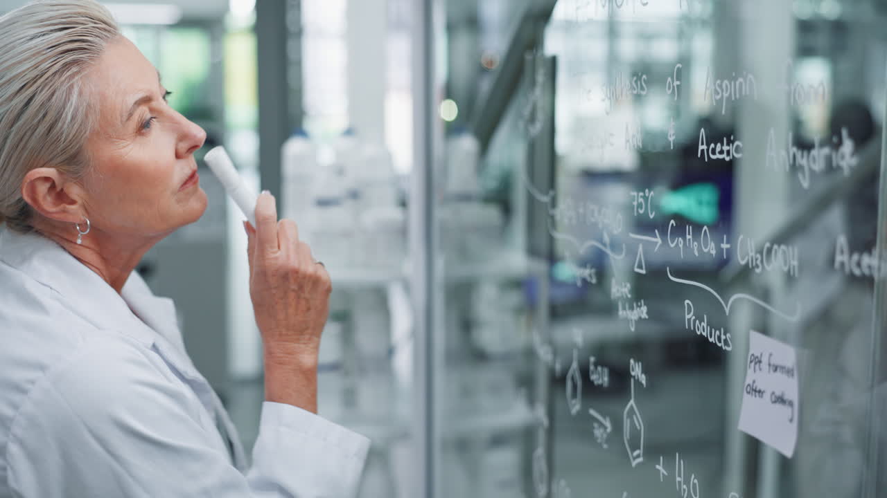 Scientist working with chemical formulas