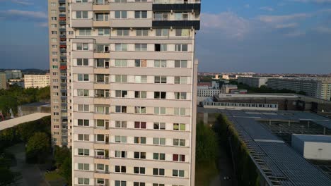 halle neustadt, a district of halle saale in germany, showing the typical plattenbau buildings at sunset. gorgeous aerial view flight dolly left drone