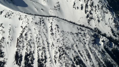 steep alpine mountains covered with snow during winter