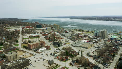 bustling downtown of a small waterfront city during the daytime