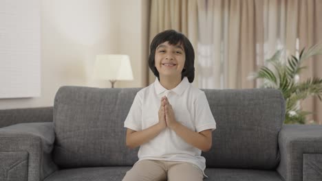 Cute-Indian-boy-doing-Namaste-and-greetings