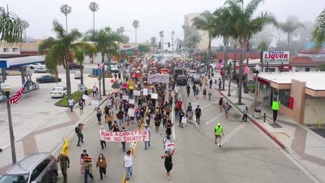 excellent aerial over crowds large black lives matter blm protest march marching through a small town ventura california