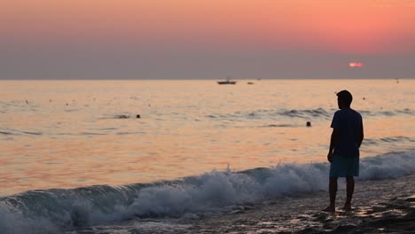 sad young man walking in sunset