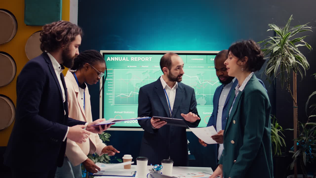 Startup colleagues reviewing data to improve customer satisfaction and retention