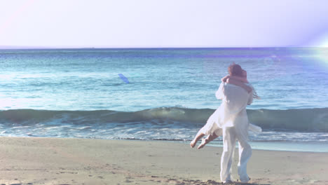 Animation-of-light-moving-over-happy-caucasian-couple-on-beach