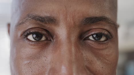 close up of african american male doctor looking at camera, slow motion