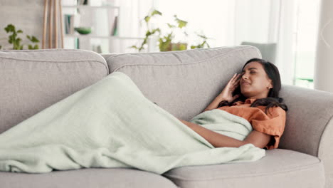 Woman-with-headache,-lying-on-couch-and-sick