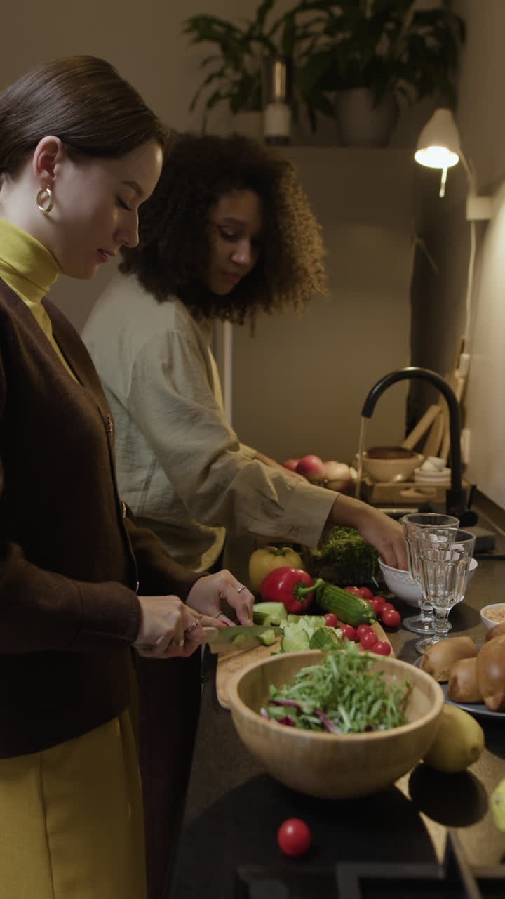 Two Women Preparing Food in a Kitchen