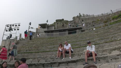 people at an outdoor stone amphitheater
