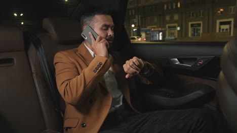 man talking on phone in cab