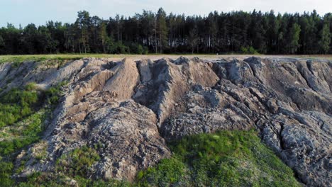 Drone-dolly-shot-of-dunes-and-cliff