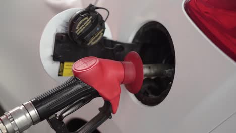 car being fueled at a gas station