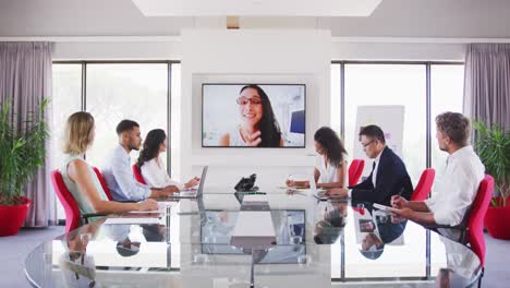 professional businesspeople in video conference in meeting room in modern office in slow motion