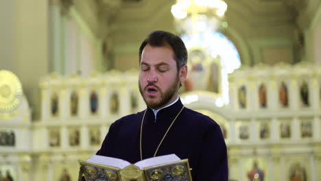 Priest-holding-holy-book