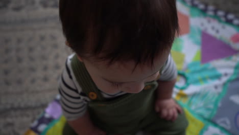 hispanic baby curiosity in living room