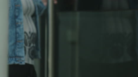 pregnant woman leaving a building
