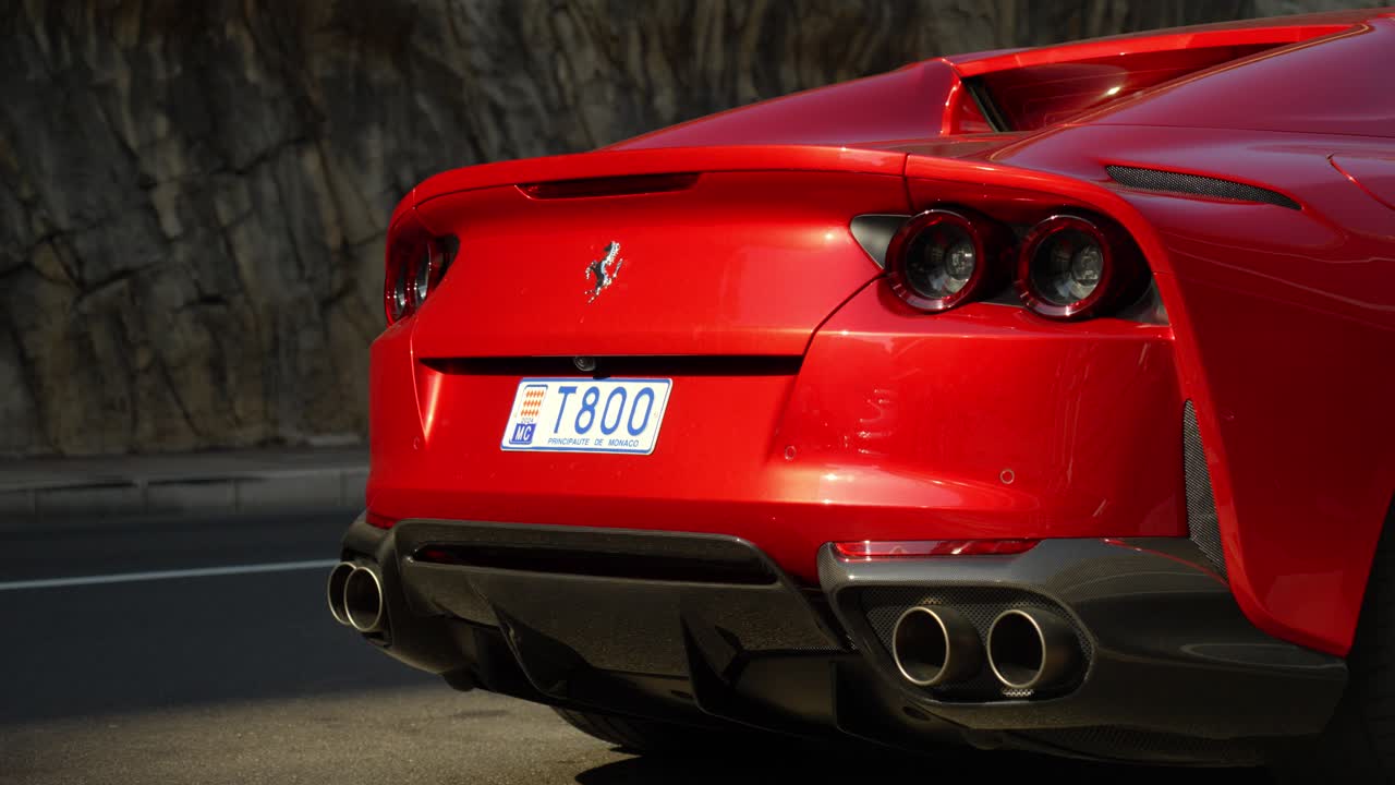 Slow establishing shot of the rear end of the ferrari 812 parked in monaco