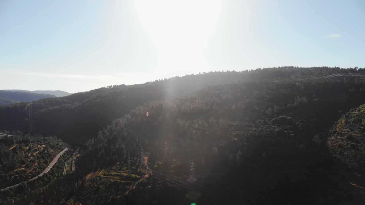 Jerusalem mountains aerial footage, golden hour sun sunset dynamic slow movement to the left.