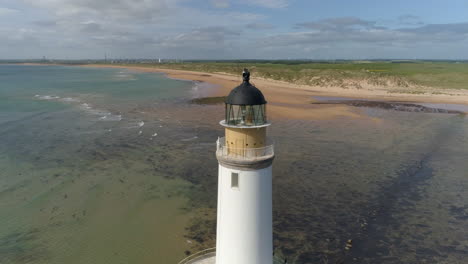 Aerial-footage-of-Rattray-Head-lighthouse,-Buchan,-Aberdeenshire,-Scotland