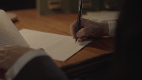 signing documents at night