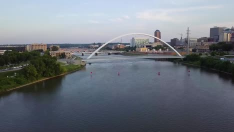 aerial drone footage of the des moines river, bridges and streets and high rise buildings of downtown des moines iowa