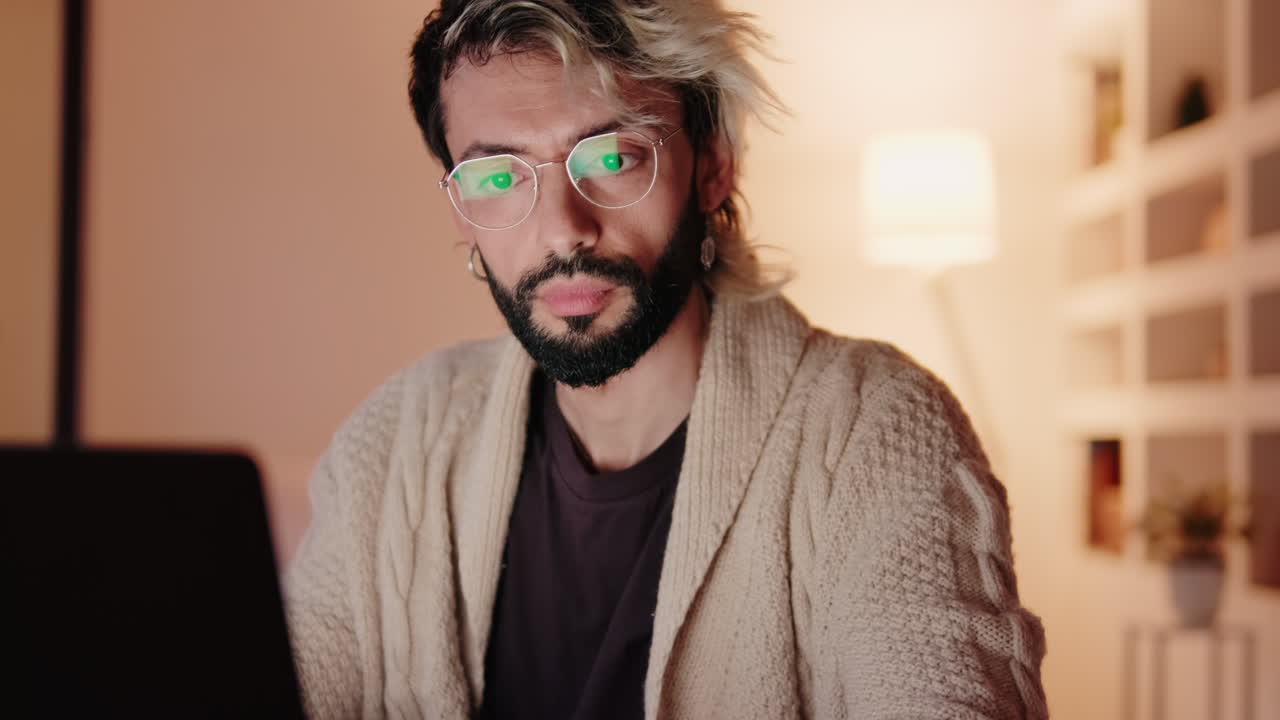 Gay Couple at Home Working on Laptop