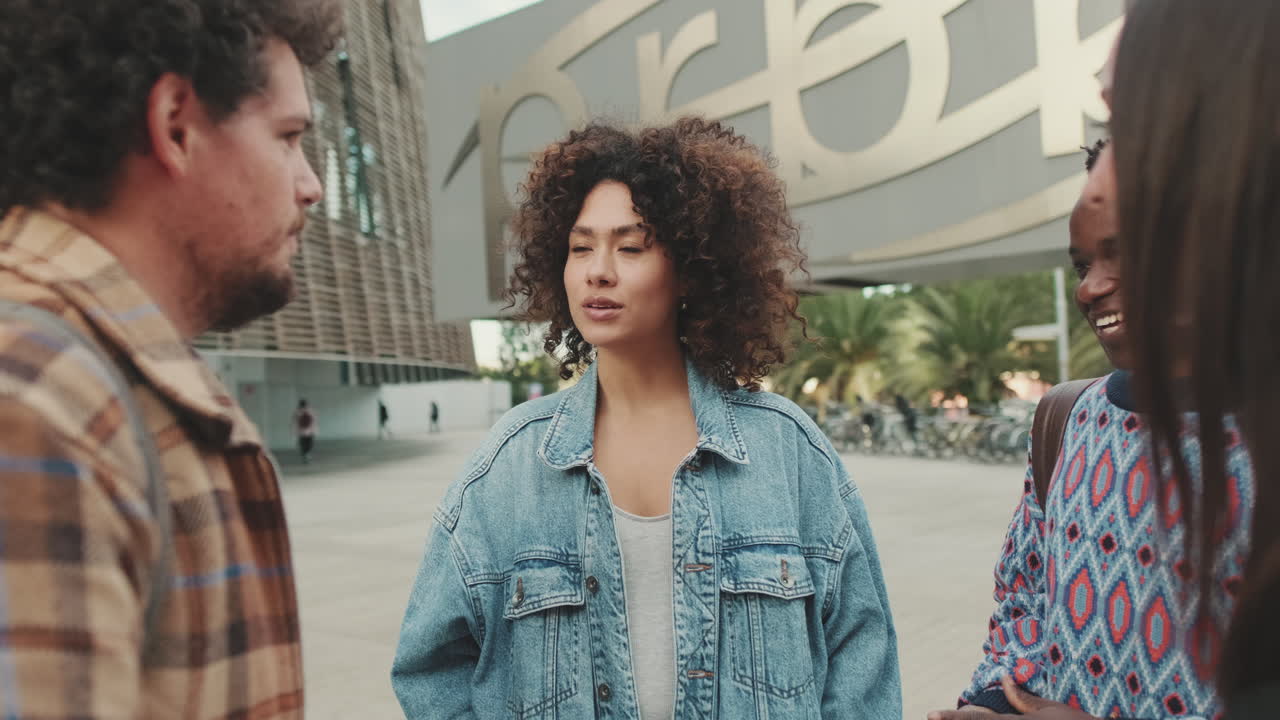 Group of friends talking outdoors in urban setting