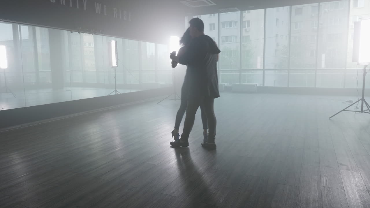Couple Dancing Salsa in Studio