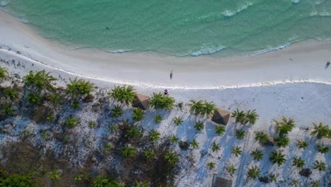 tourist walking on the white sand beach of koh rong island in cambodia, asia amazing aerial view flight speed ramp hyper motion time lapse