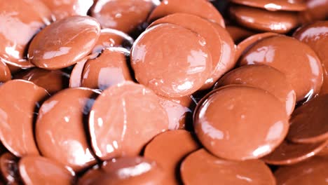 chocolate disks tumbling and piling up