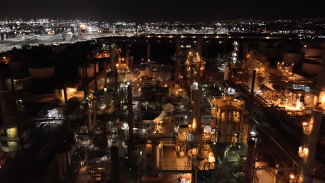 oil refinery at nighttime - aerial flyover