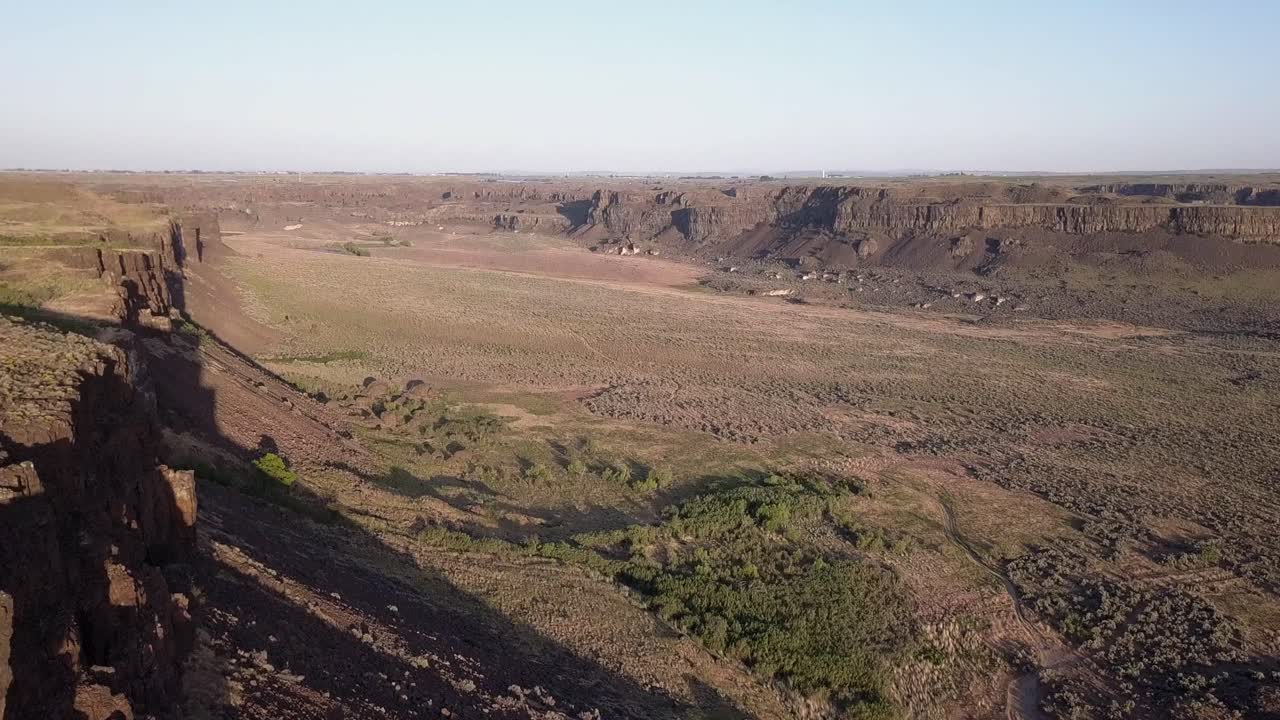 Aerial tilts down to view Ancient Lakes in Potholes Coulee, WA state