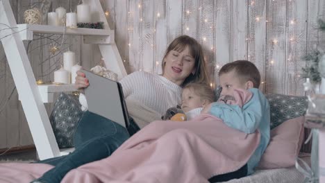 mom takes care of daughter gets help from son with tablet