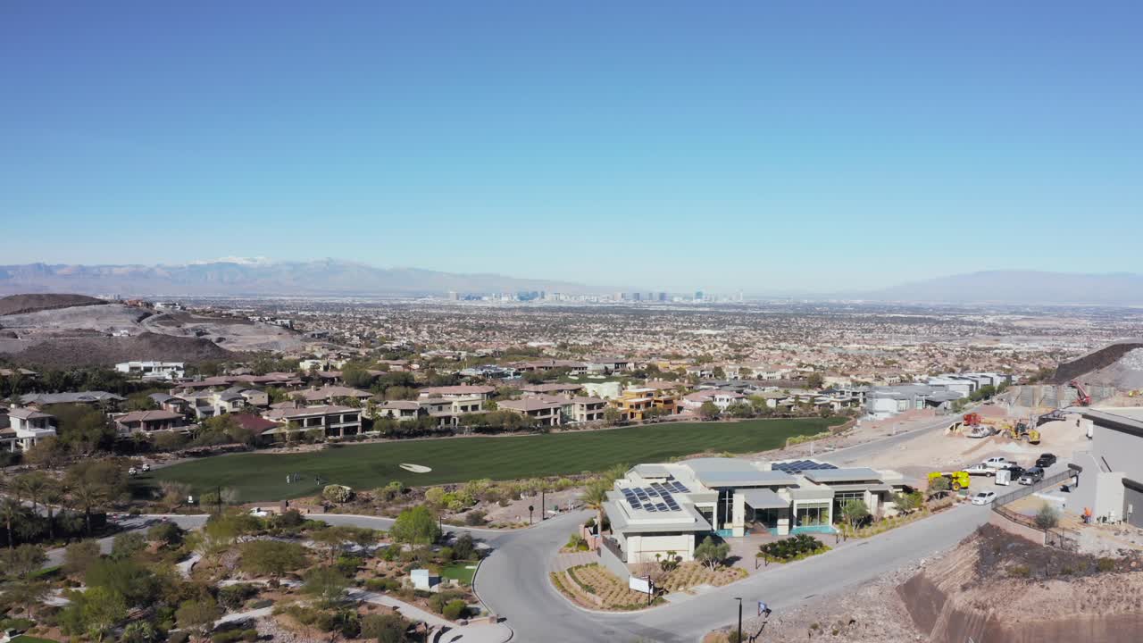 House construction development with golf course reveal to Las Vegas skyline in distance