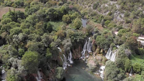 aerial: kravica waterfall in bosnia and hercegovina. vertical pan