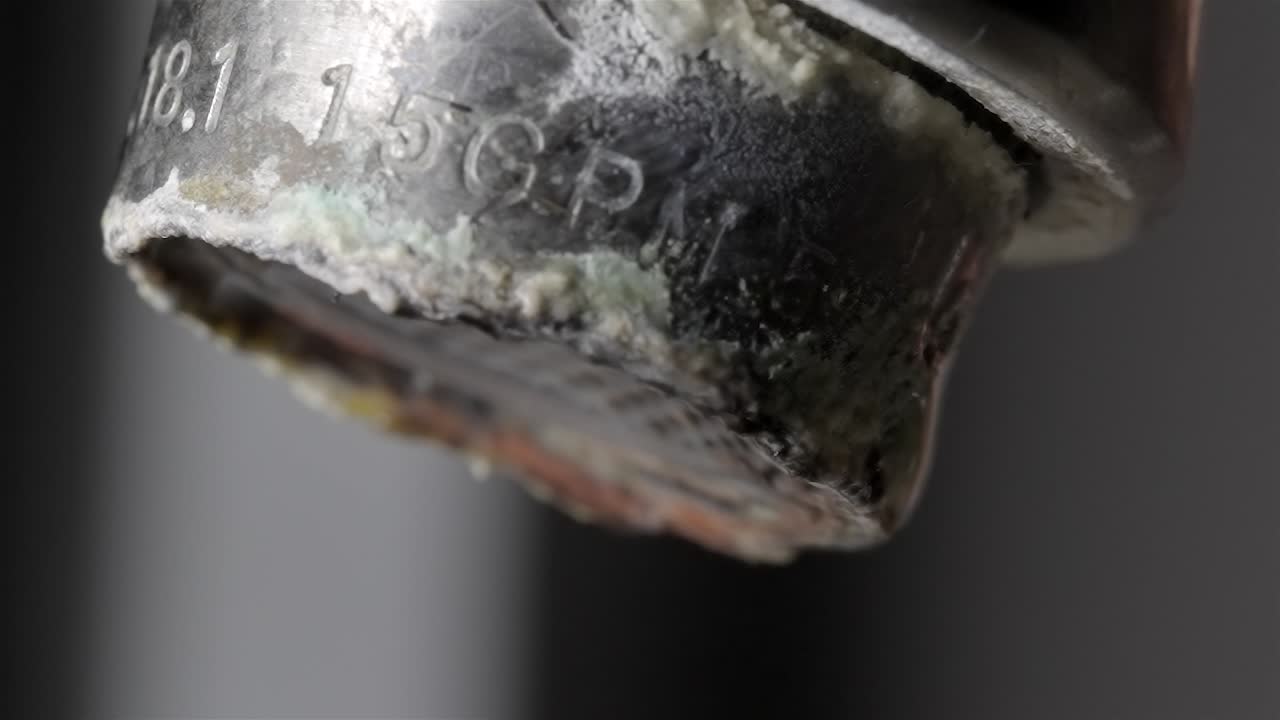 Close View of Hard Water Scale on Metal Tap Fixture
