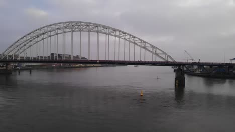 scenic view of suspension bridge over noord river in the netherlands - wide shot