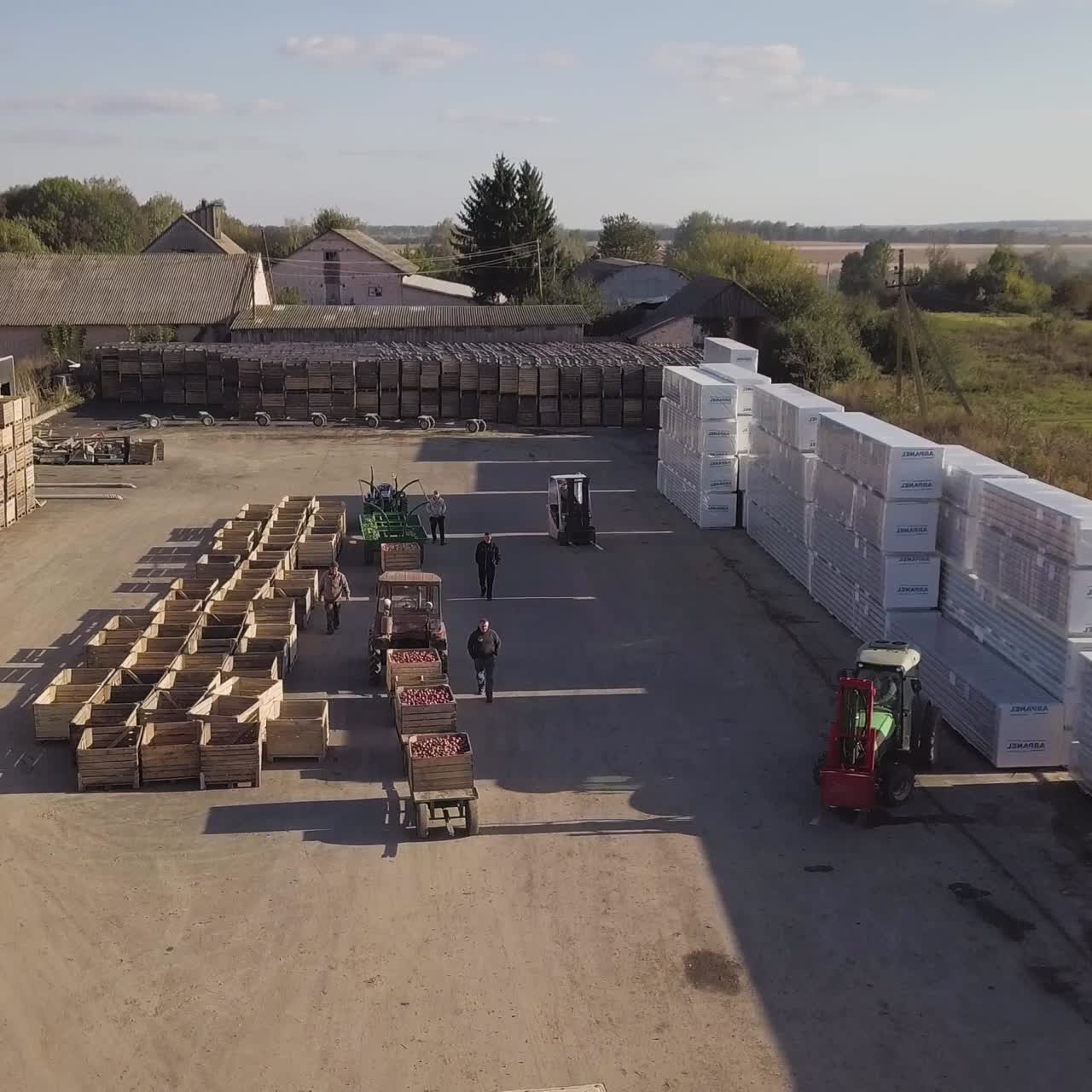 Forklift with apples in wooden crates
