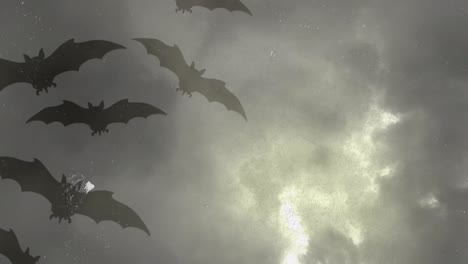 Animation-of-halloween-grey-bats-over-grey-stormy-sky-with-lightnings-in-background
